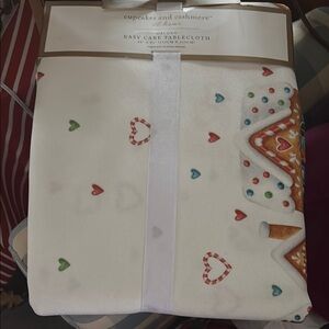 60 by 84” rectangle Christmas mad table cloth. New with tags.